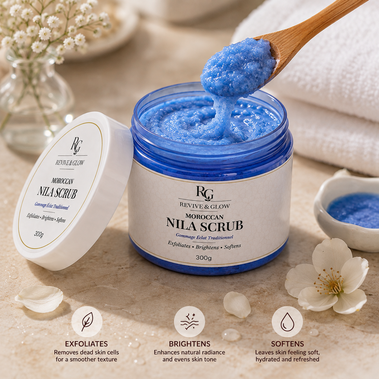 Revive & Glow Moroccan Nila Scrub 300g with a wooden spatula lifting the bright blue exfoliating scrub to showcase its rich texture and consistency.