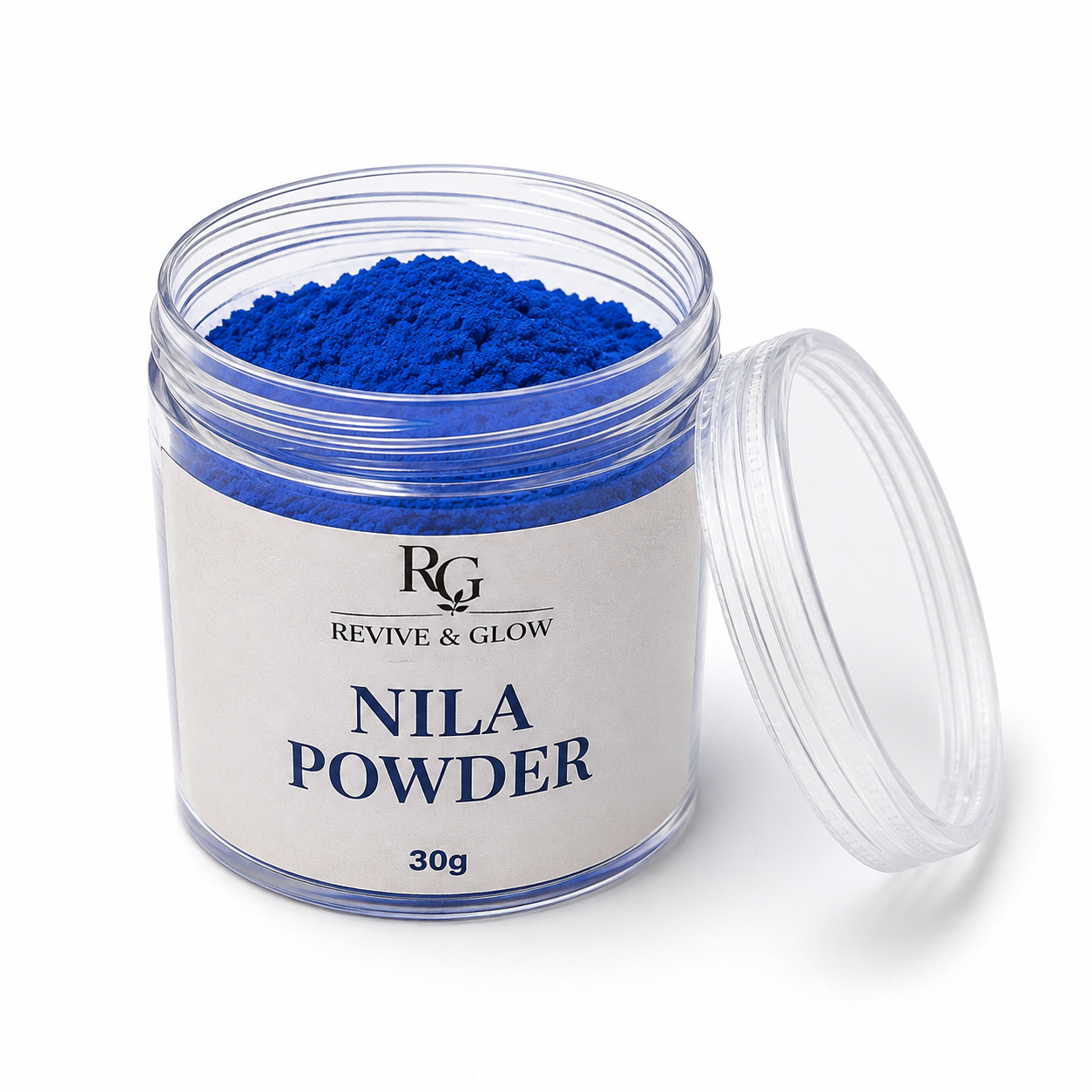 A clear plastic jar filled with bright blue powder, labeled 'RG REVIVE & GLOW NILA POWDER 30g', with the clear lid leaning against the right side on a white background.