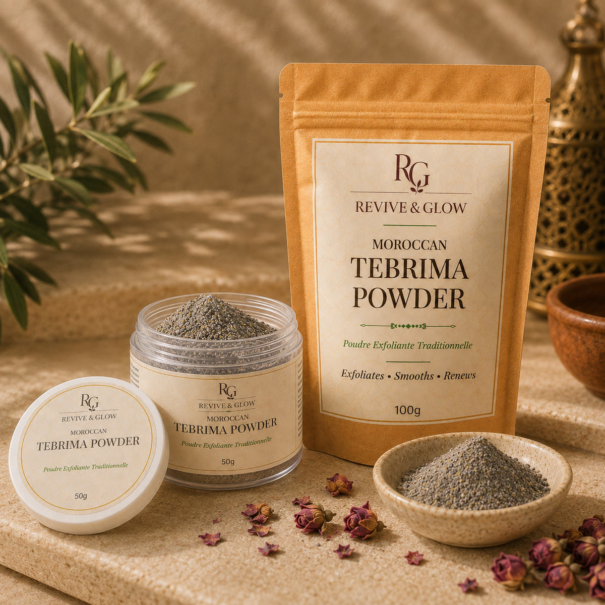 Revive & Glow Moroccan Tebrima Powder shown in a kraft stand-up pouch, a clear jar with lid, and a small bowl of loose powder on a beige surface with dried rosebuds and greenery in the background.