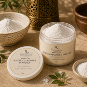 A jar of Revive & Glow Moroccan White Ghassoul Powder with its lid placed beside it on a textured beige surface, surrounded by bowls of white powder and small green leaves.
