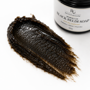 Close-up of authentic Moroccan Black Beldi Soap texture showing its thick, smooth, olive-based consistency.