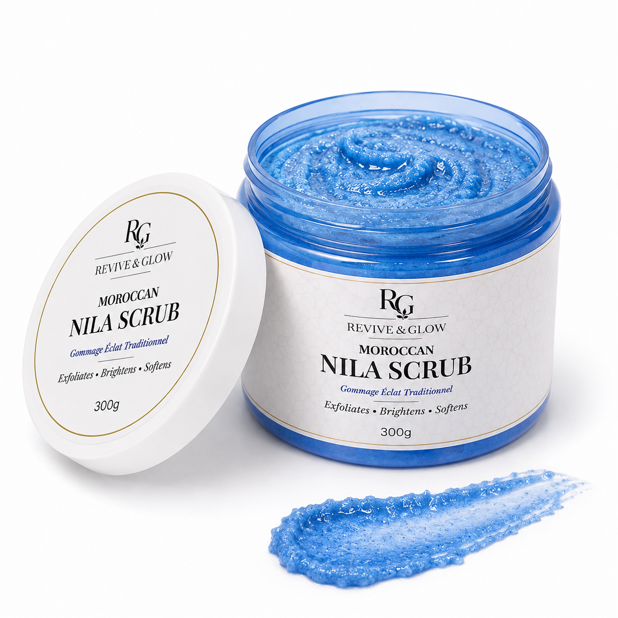 Revive & Glow Moroccan Nila Scrub 300g in an open blue jar with white lid, showcasing the exfoliating scrub texture on a white background.